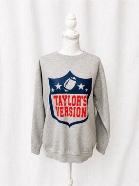 Grey Crewneck Sweatshirt with Navy Shield and Red Graphic